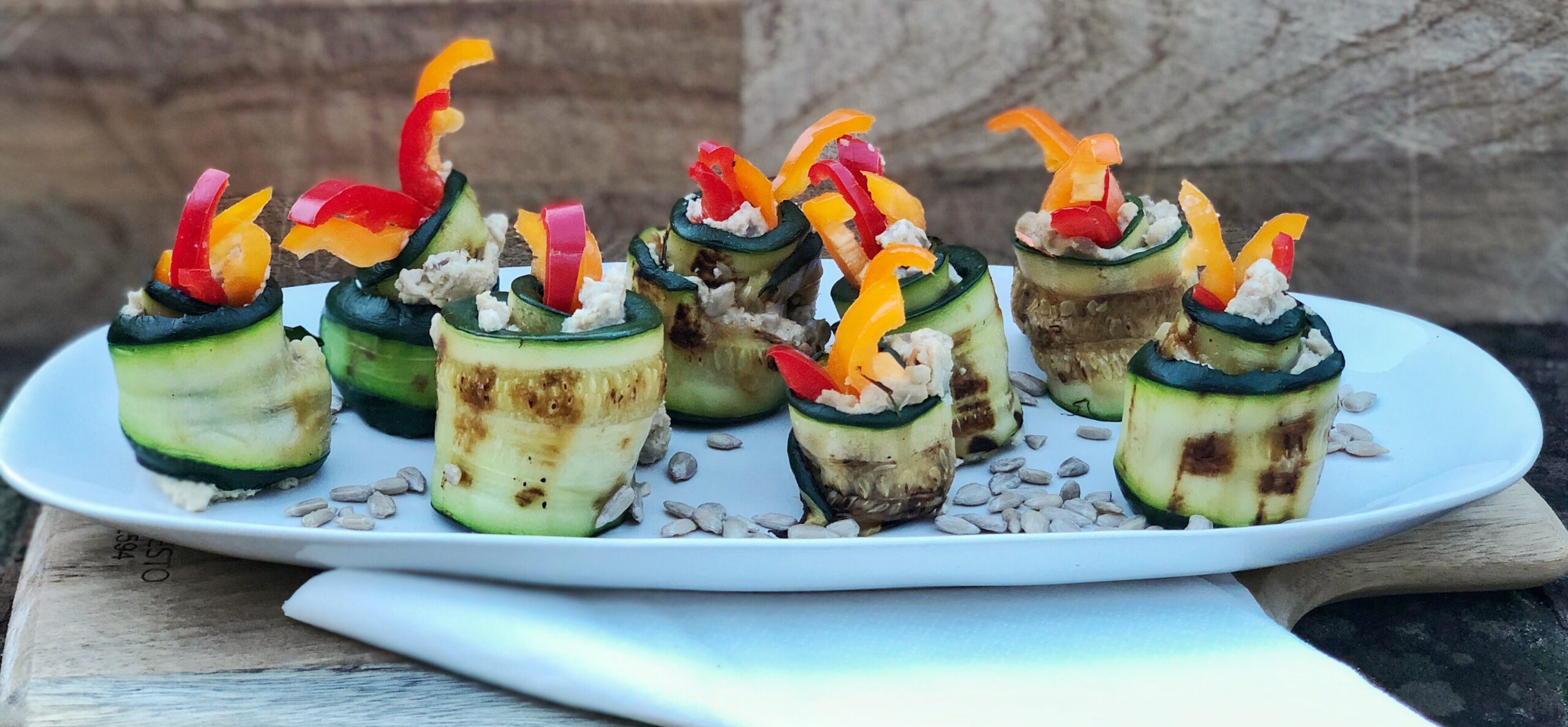 Vegan courgette rolls stuffed with sunflower seed hummous