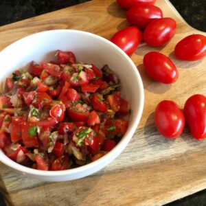 Tomato salsa with homemade healthy chicken fajitas, May Simpkin Nutritionist