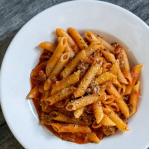 Penne pasta with beef ragu; May Simpkin