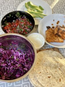 Healthy fish tacos with colourful accompaniments, May Simpkin Nutritionsit